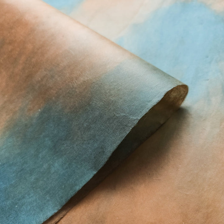 Elegant handmade mulberry paper by Kozo Studio in a woodland overcast colorway, featuring a soft ombre blend and natural surface texture.