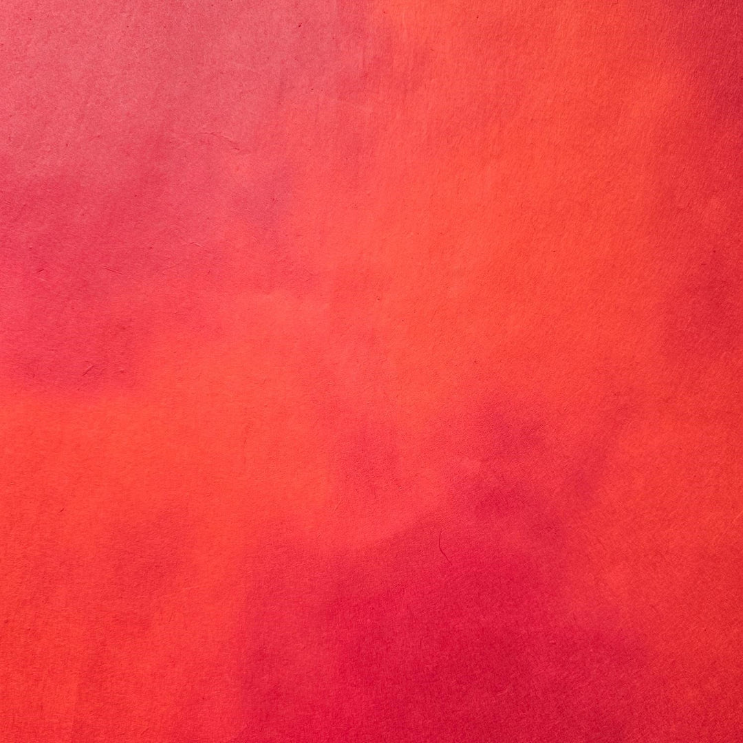 A beautifully hand-colored sheet of Kozo Studio mulberry paper, highlighting its elegant ombre effect and natural handmade paper texture.
