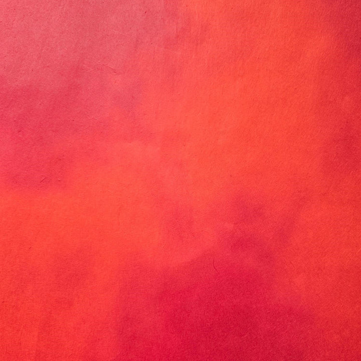A beautifully hand-colored sheet of Kozo Studio mulberry paper, highlighting its elegant ombre effect and natural handmade paper texture.