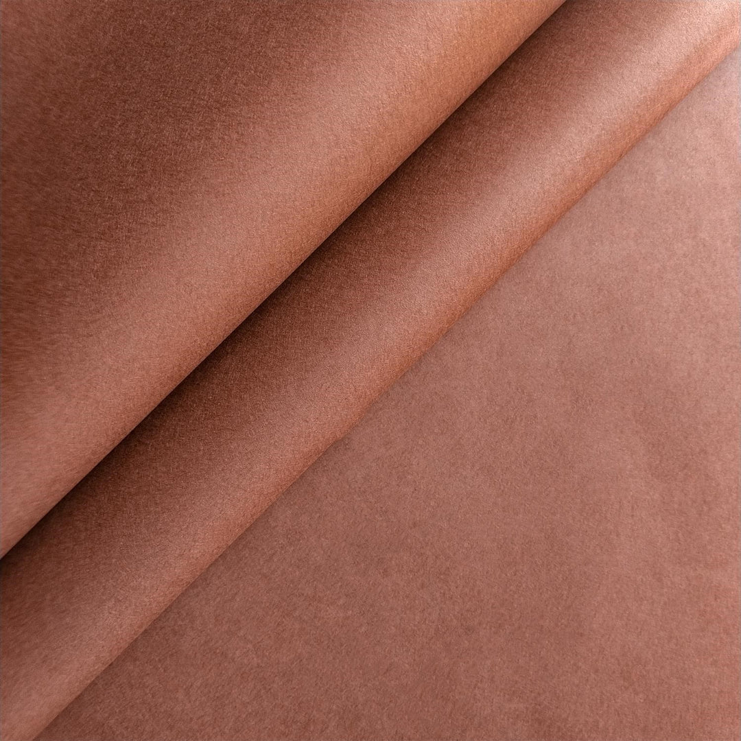 Close-up view of solid-colored mulberry paper in amber brown by Kozo Studio, featuring smooth handmade paper texture and minimalist design.