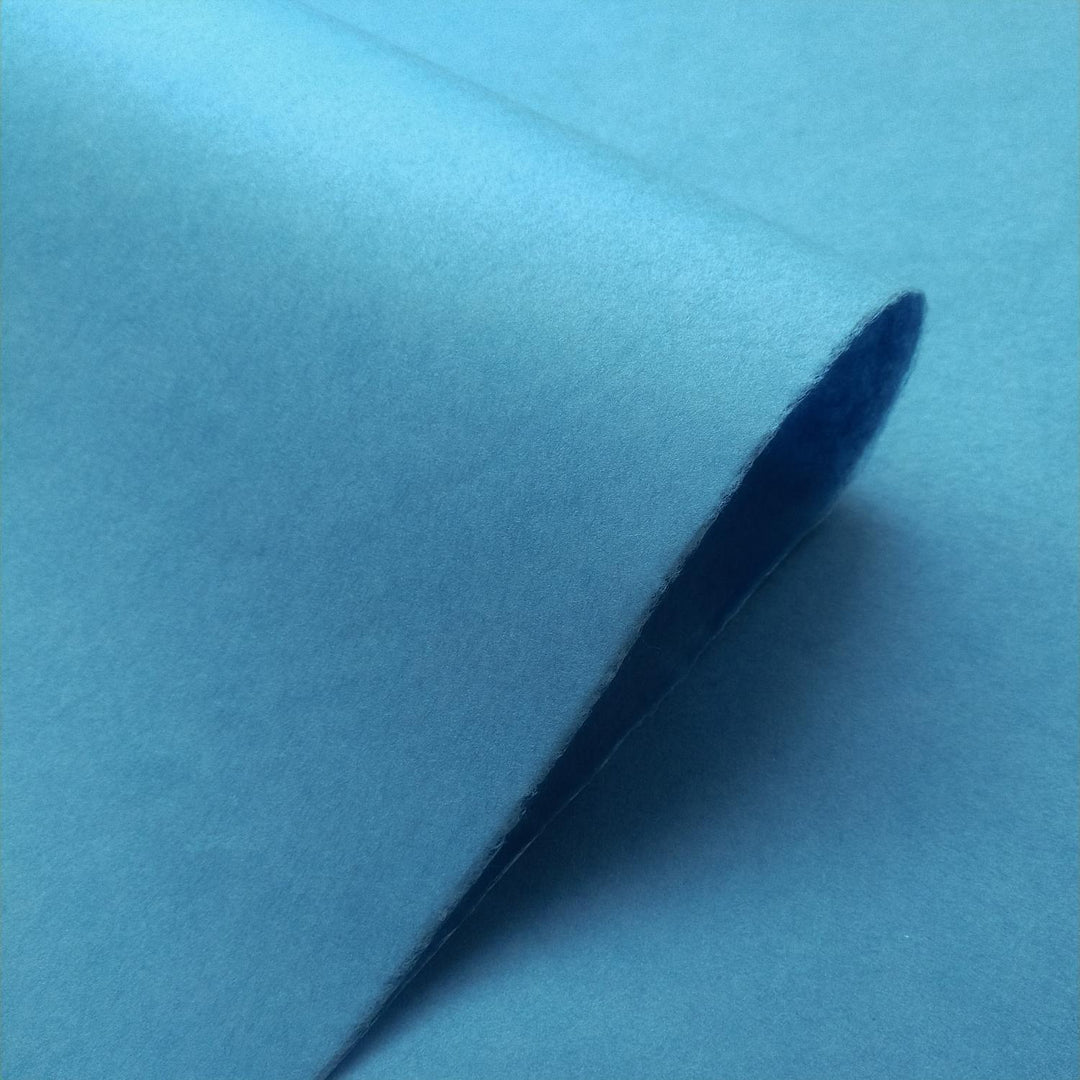 Smooth cobalt blue mulberry paper captured up close from Kozo Studio, illustrating the delicate texture of quality handmade paper.