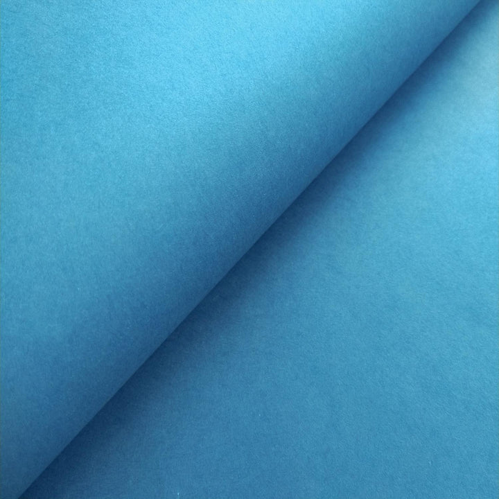 Detailed view of solid-colored Kozo Studio handmade paper in cobalt blue, featuring the elegant texture of authentic mulberry paper.