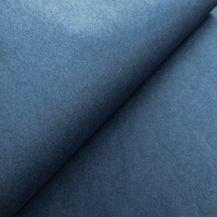 High-resolution image of solid-colored mulberry paper in denim blue from Kozo Studio with smooth handmade finish.