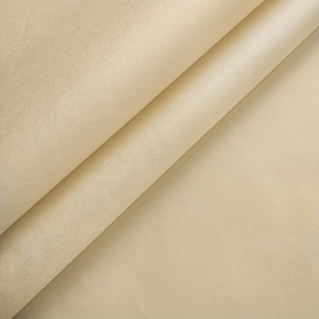 Close-up of two overlapping sheets of ivory mulberry paper from Kozo Studio, showcasing the soft texture and elegant handmade paper folds.