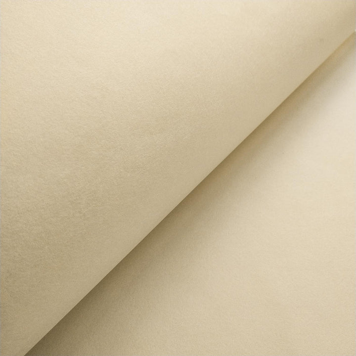 Kozo Studio mulberry paper in ivory shown in a close-up with overlapping folds, displaying the delicate handmade surface and organic finish.