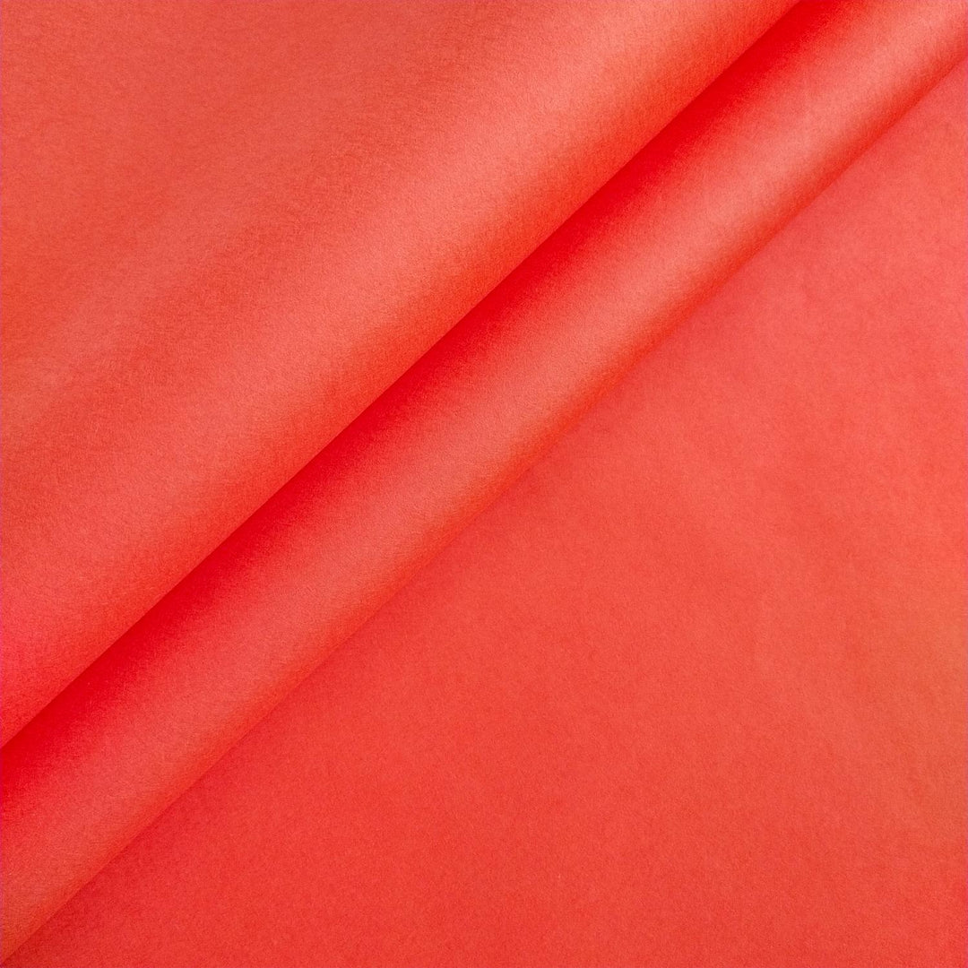 Close-up of Kozo Studio handmade paper in Nasturtium color, highlighting the smooth texture and subtle sheen of mulberry paper with delicate diagonal creases.