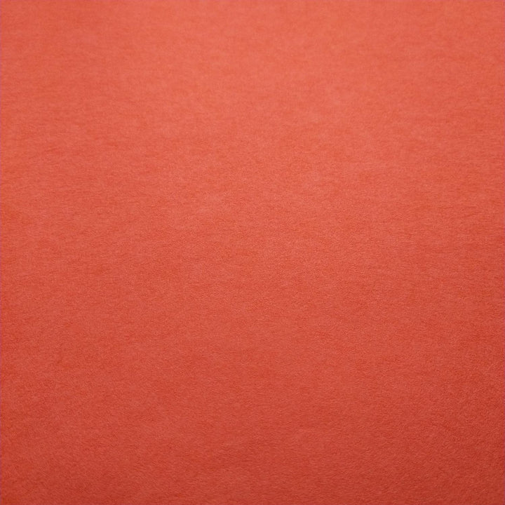 Kozo Studio Nasturtium handmade paper featuring a folded sheet of mulberry paper with visible creases and a refined, smooth finish.