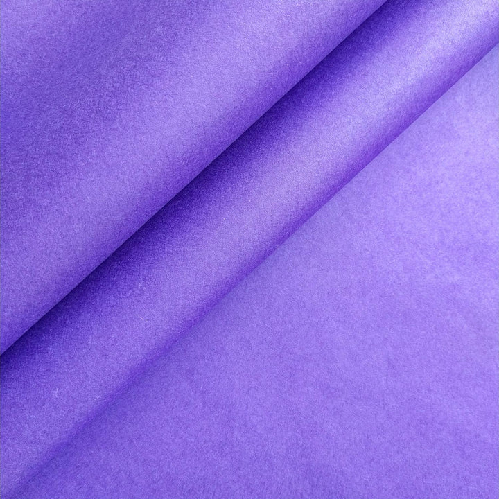 Solid-colored purple mulberry paper from Kozo Studio with a smooth surface and visible fiber under soft lighting.