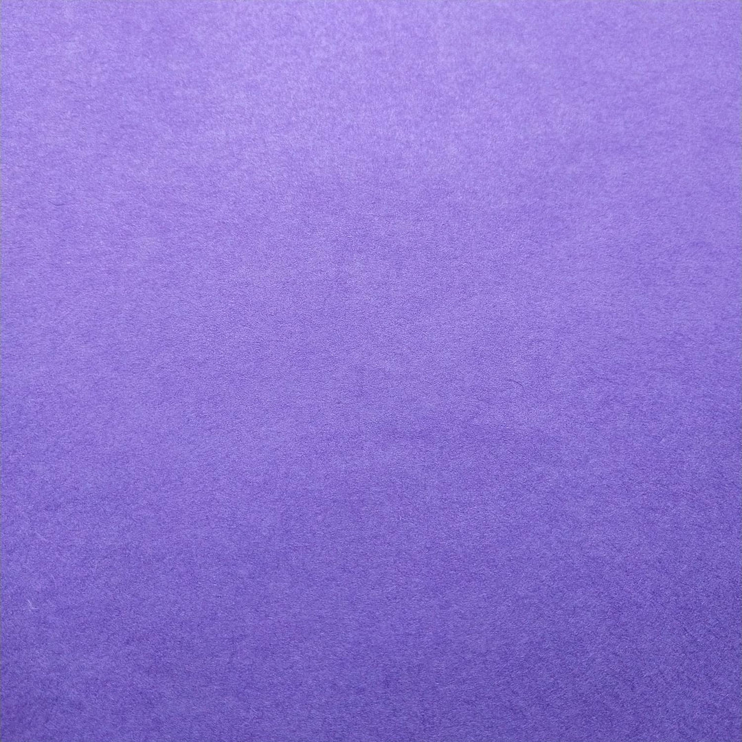 Close-up of handmade purple Kozo Studio paper showing subtle texture and rich mulberry paper hues.