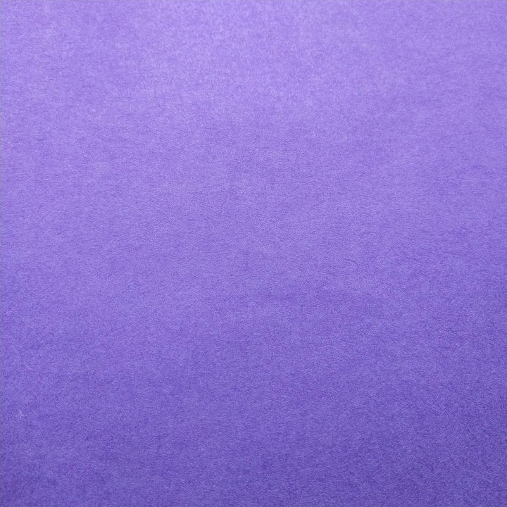 Close-up of handmade purple Kozo Studio paper showing subtle texture and rich mulberry paper hues.