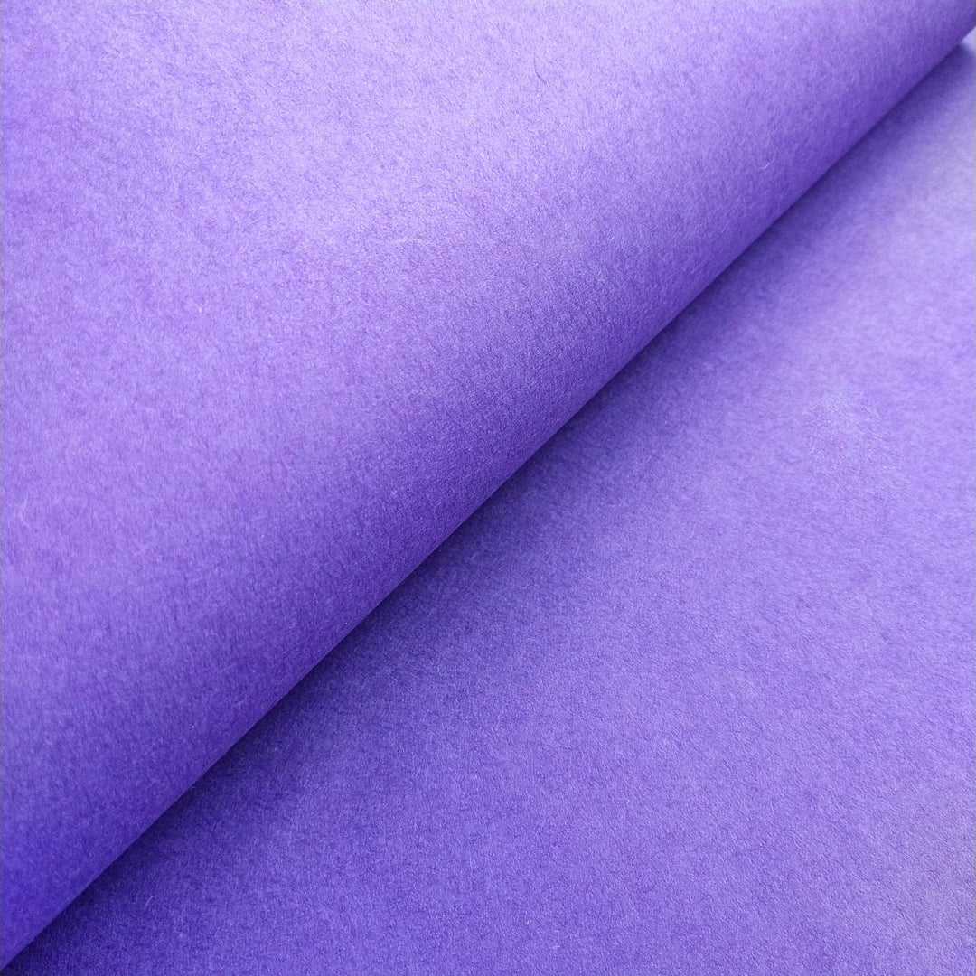 Kozo Studio mulberry paper in a deep purple tone with even texture and lighting that reveals fine paper fibers.