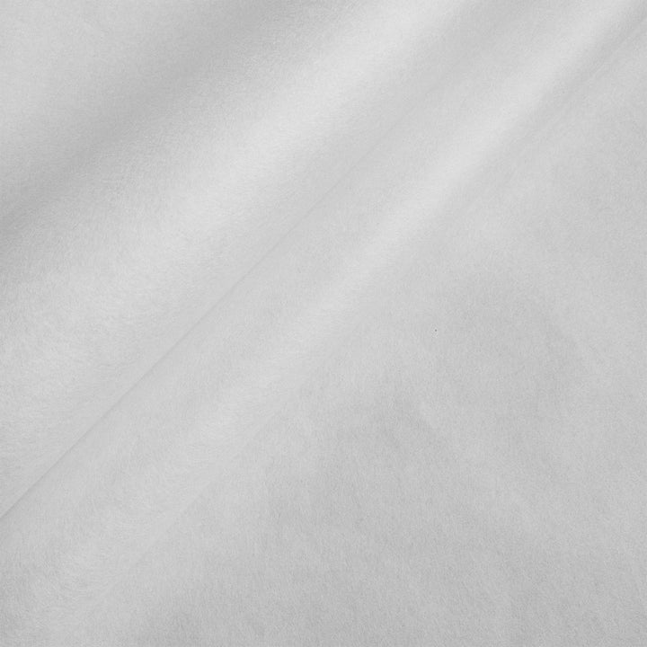 Close-up view of solid white mulberry paper by Kozo Studio showing smooth handmade texture with natural kozo fibers.
