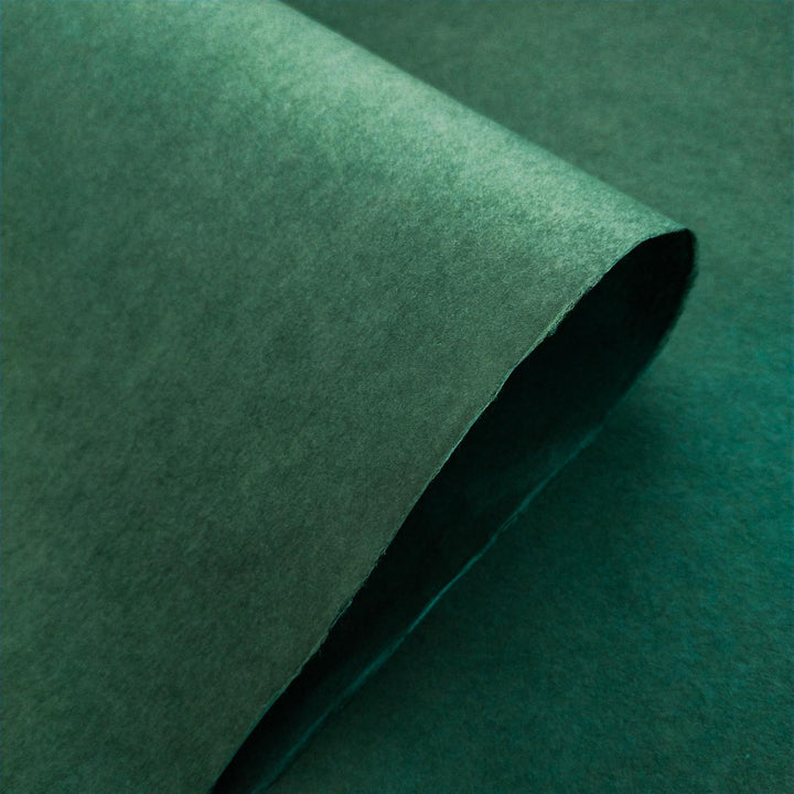 Detailed shot of Kozo Studio handmade paper in Amazon Green, showcasing the fine texture of mulberry paper.