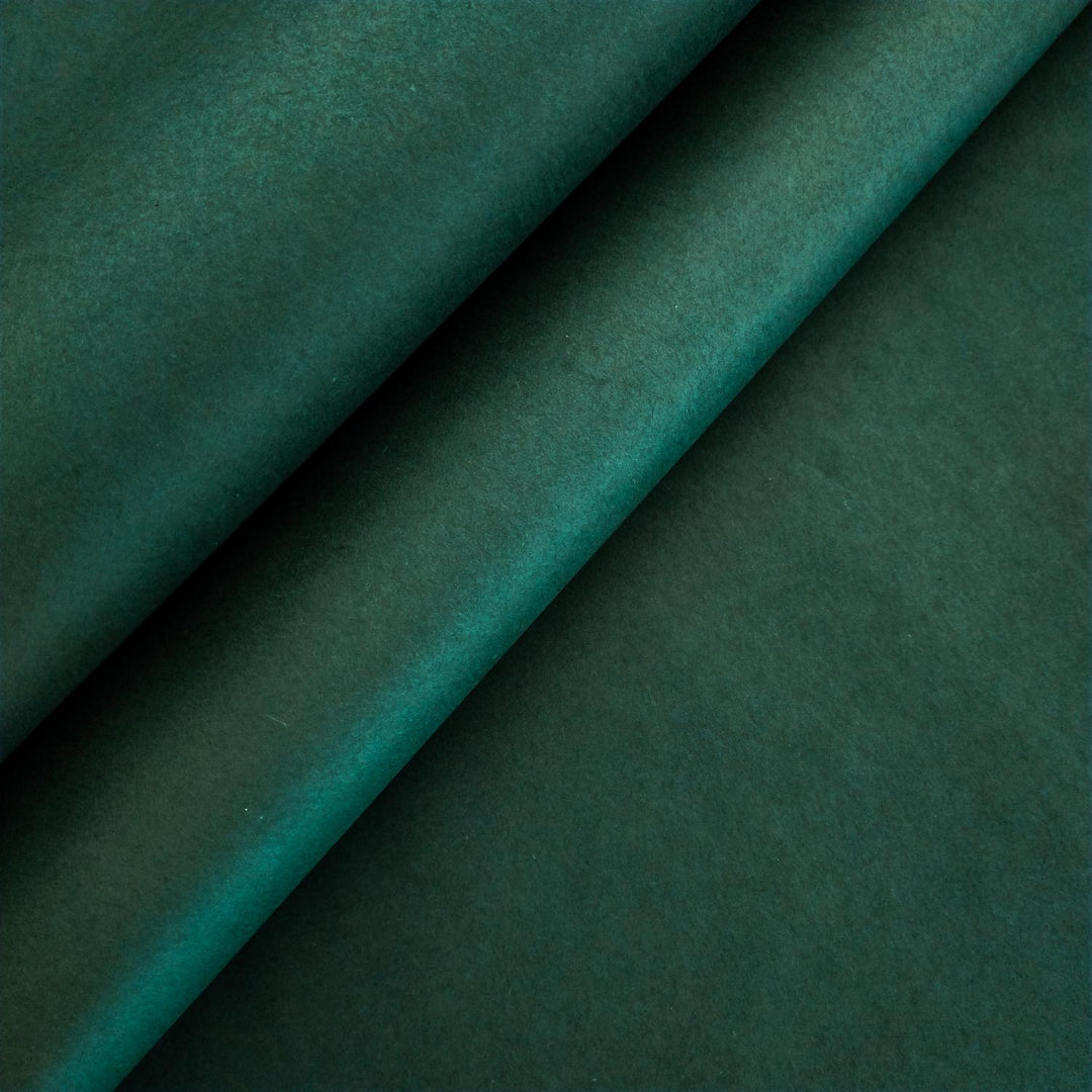 Close-up of handmade mulberry paper in Amazon Green by Kozo Studio, showing the soft texture and natural fibers.