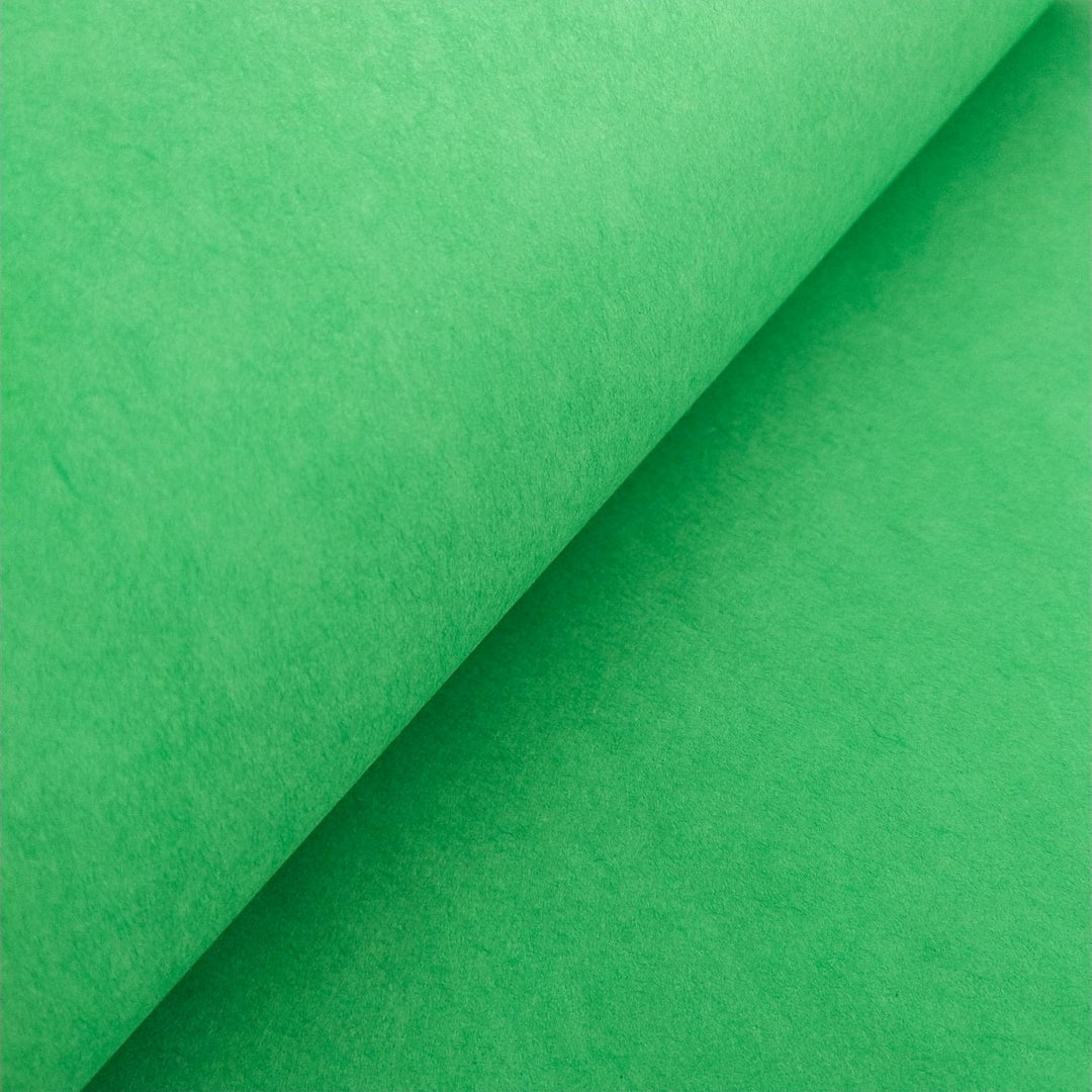Smooth and richly colored forest green mulberry paper folded with care, crafted by Kozo Studio using traditional handmade techniques.