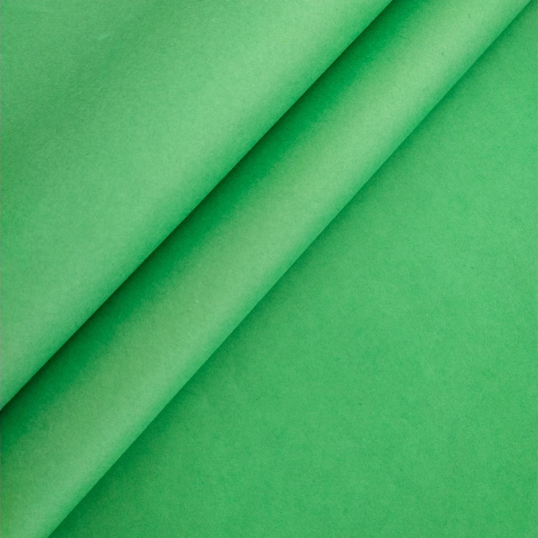Close-up of forest green handmade paper from Kozo Studio, highlighting the smooth texture and rich tone of high-quality mulberry paper.