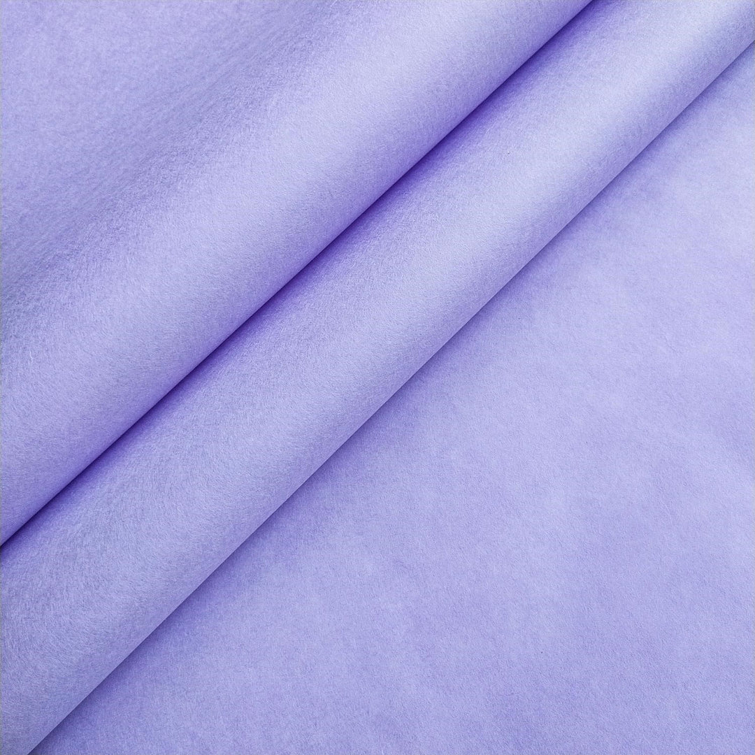 Heather purple mulberry paper from Kozo Studio, highlighting the thickness and soft surface of this handcrafted paper.