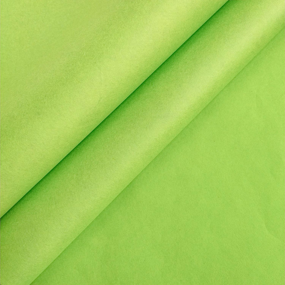 Close-up of olive green mulberry paper by Kozo Studio, showcasing the soft texture and smooth surface of premium handmade paper.