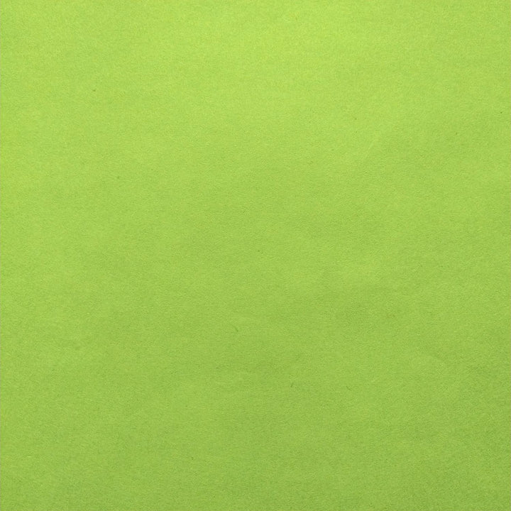 Neatly folded solid-colored handmade paper in olive green from Kozo Studio, highlighting the fine quality of mulberry paper.