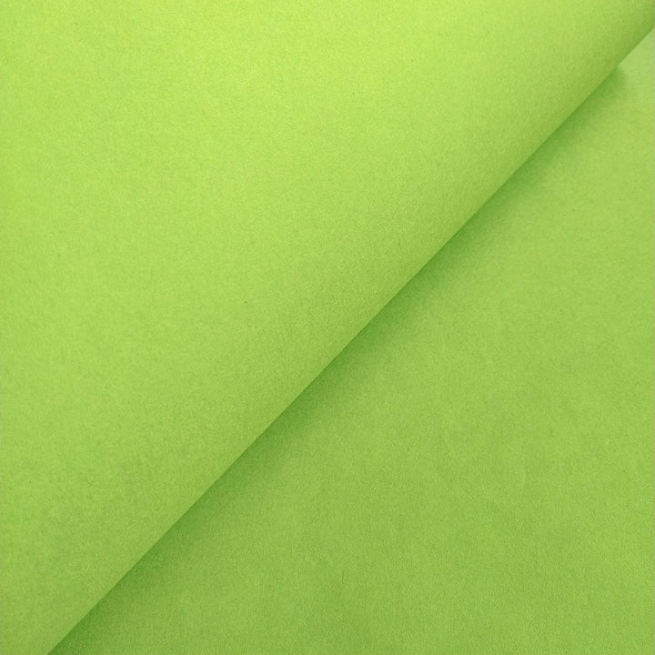 Kozo Studio's solid-colored olive green mulberry paper, folded to display the rich texture and high quality of handmade paper.