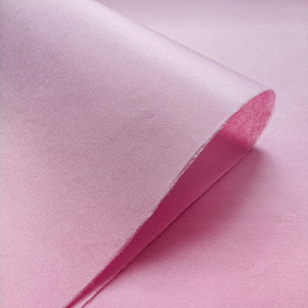 Elegant draping of Kozo Studio mulberry paper in soft pink highlighting the unique texture of handmade paper.