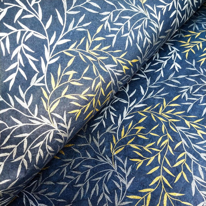 Elegant handmade paper from Kozo Studio with a Willow motif, featuring shimmering metallic branches over a navy backdrop, crafted with the fine fibers of mulberry paper.