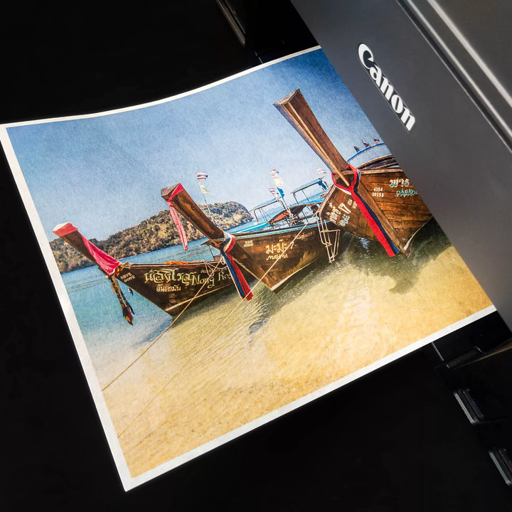 A Canon printer beautifully renders a photo of long-tail boats on a beach using Kozo Studios A4 Thin Natural Kozo Paper (10 sheets, 45 gsm), enhancing the vibrant image with its unique texture.