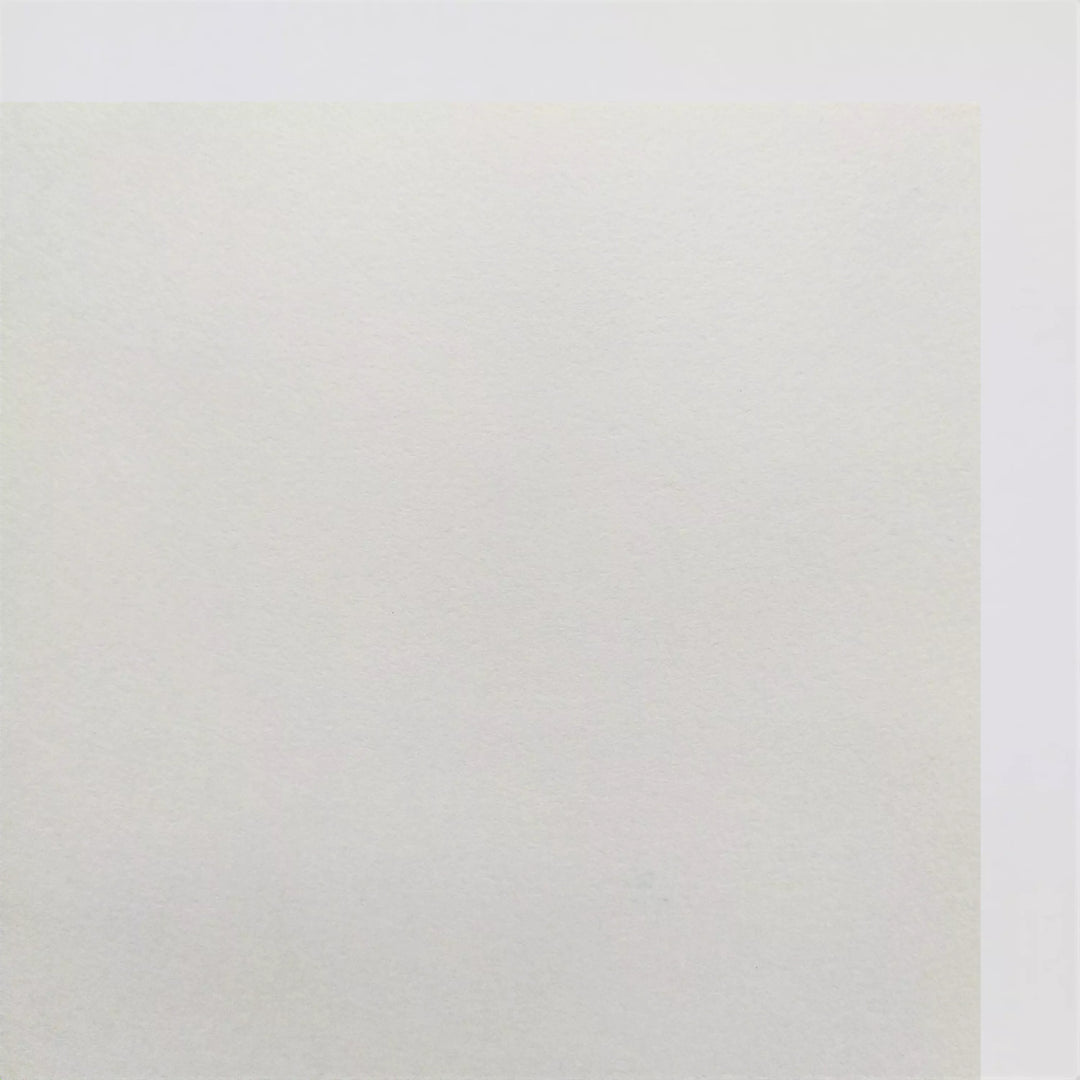 A thick white Kozo Studio Kozo Paper Roll (200 gsm) with a subtle texture fills most of the image, ideal for digital or traditional printing, calligraphy, painting, and drawing, shown against a plain white background.