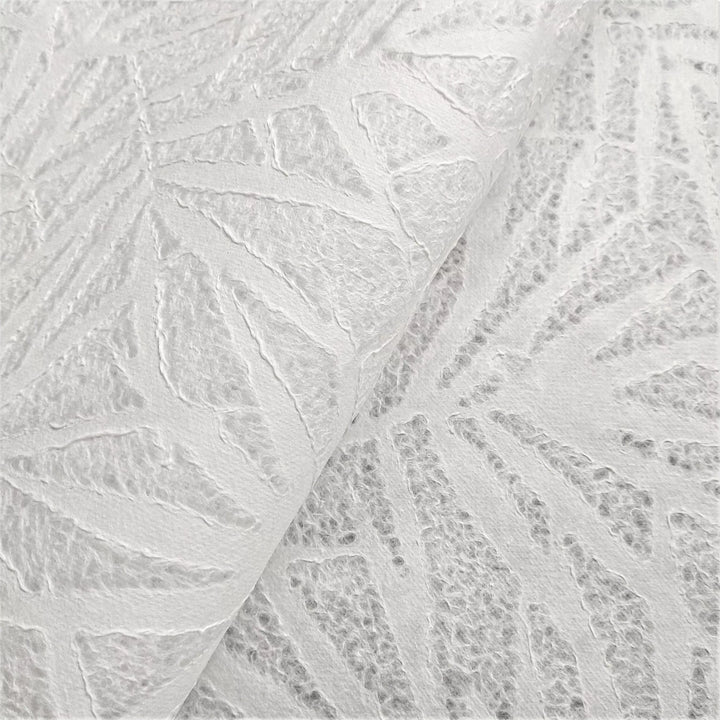 A close-up of textured Handmade Lace Kozo Paper by Kozo Studio, a rice paper with a bamboo leaf pattern.