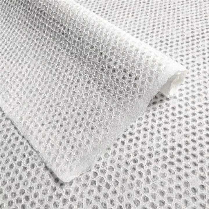 Intricate Handmade Lace Kozo Paper with Mini Dot Pattern from Kozo Studio – This elegant mulberry paper features delicate water-displaced lacework, ideal for window decor, lampshades, or fine art projects.