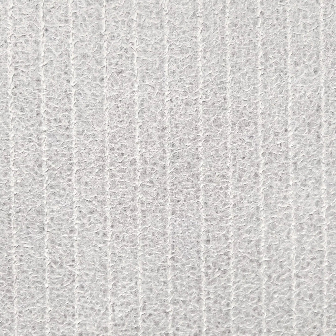 Detail of artisanal lace mulberry paper from Kozo Studio, with translucent qualities ideal for creative projects such as lampshades or window decor, crafted through traditional Rakusui technique.