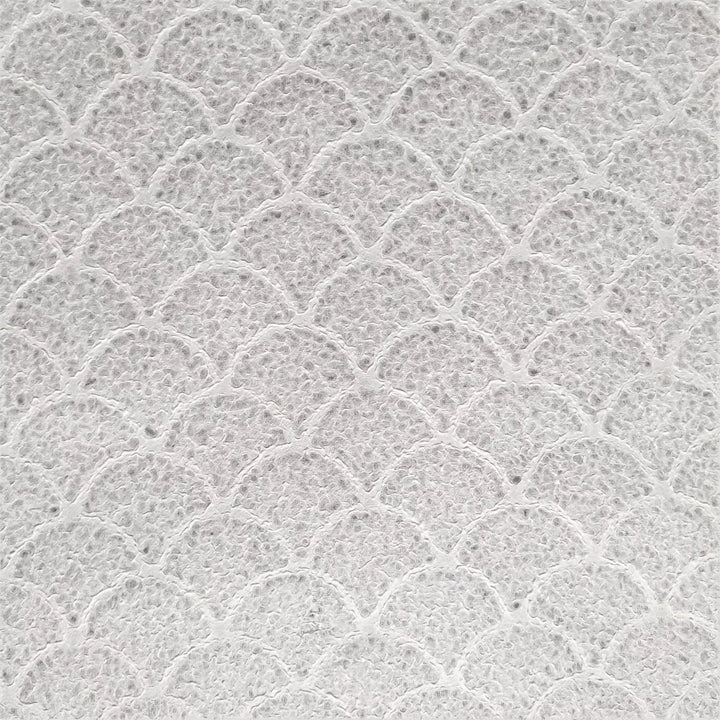 Detailed view of wave-patterned handmade mulberry paper from Kozo Studio, showcasing its raised texture and natural edges on a matching surface.