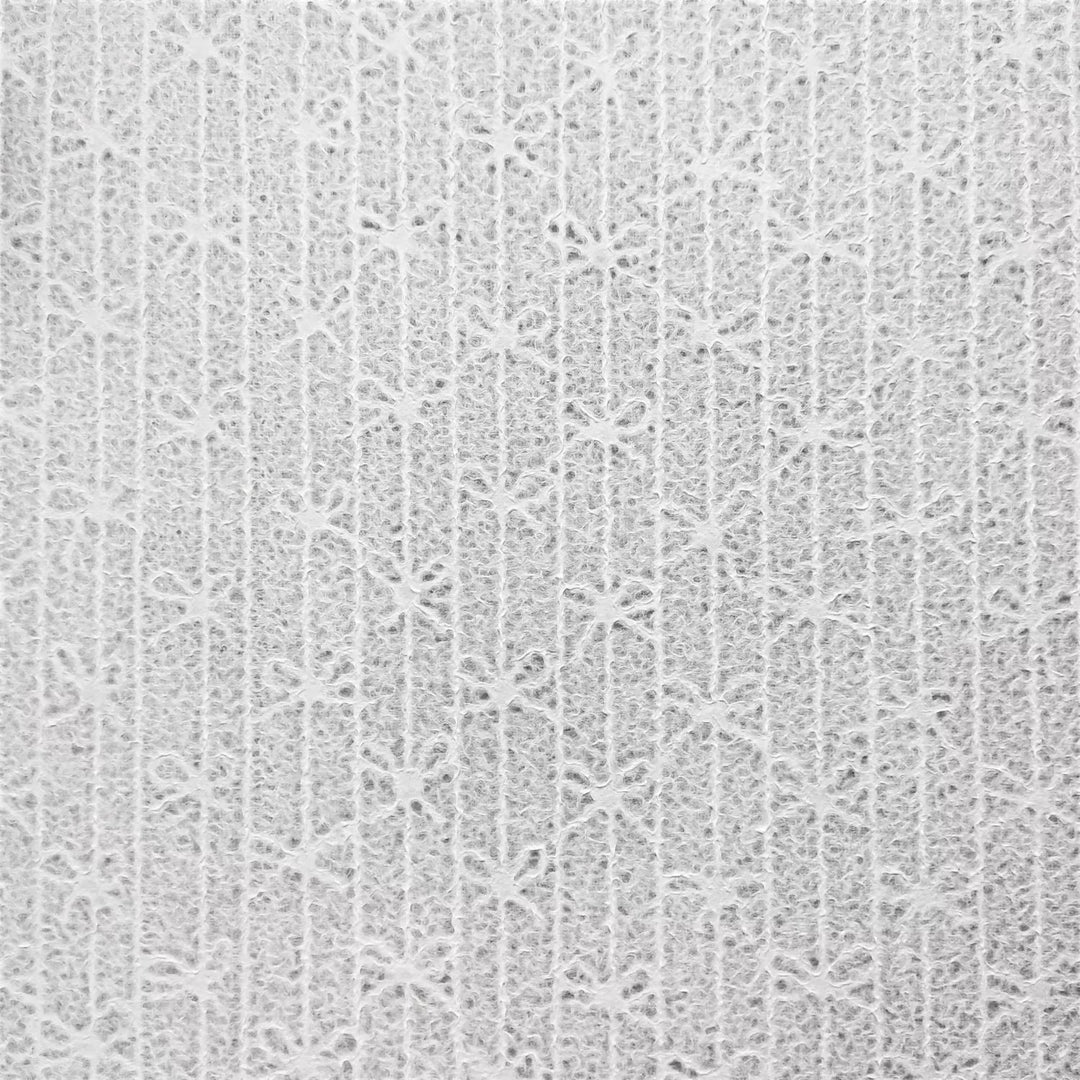 Bow-patterned lace handmade paper made from mulberry pulp at Kozo Studio, created with the unique Rakusui water displacement technique