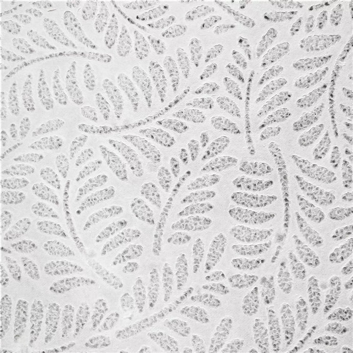 Close-up of handmade lace kozo paper from Kozo Studio, showcasing the Rakusui method to create detailed patterns in fine mulberry paper.