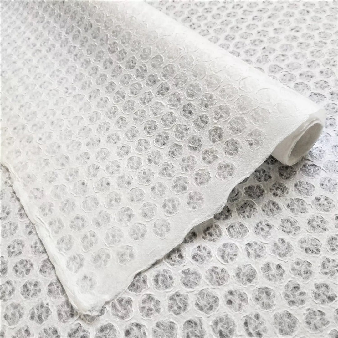 Intricately crafted handmade lace mulberry paper with polkadot pattern, produced using the Rakusui method at Kozo Studio.