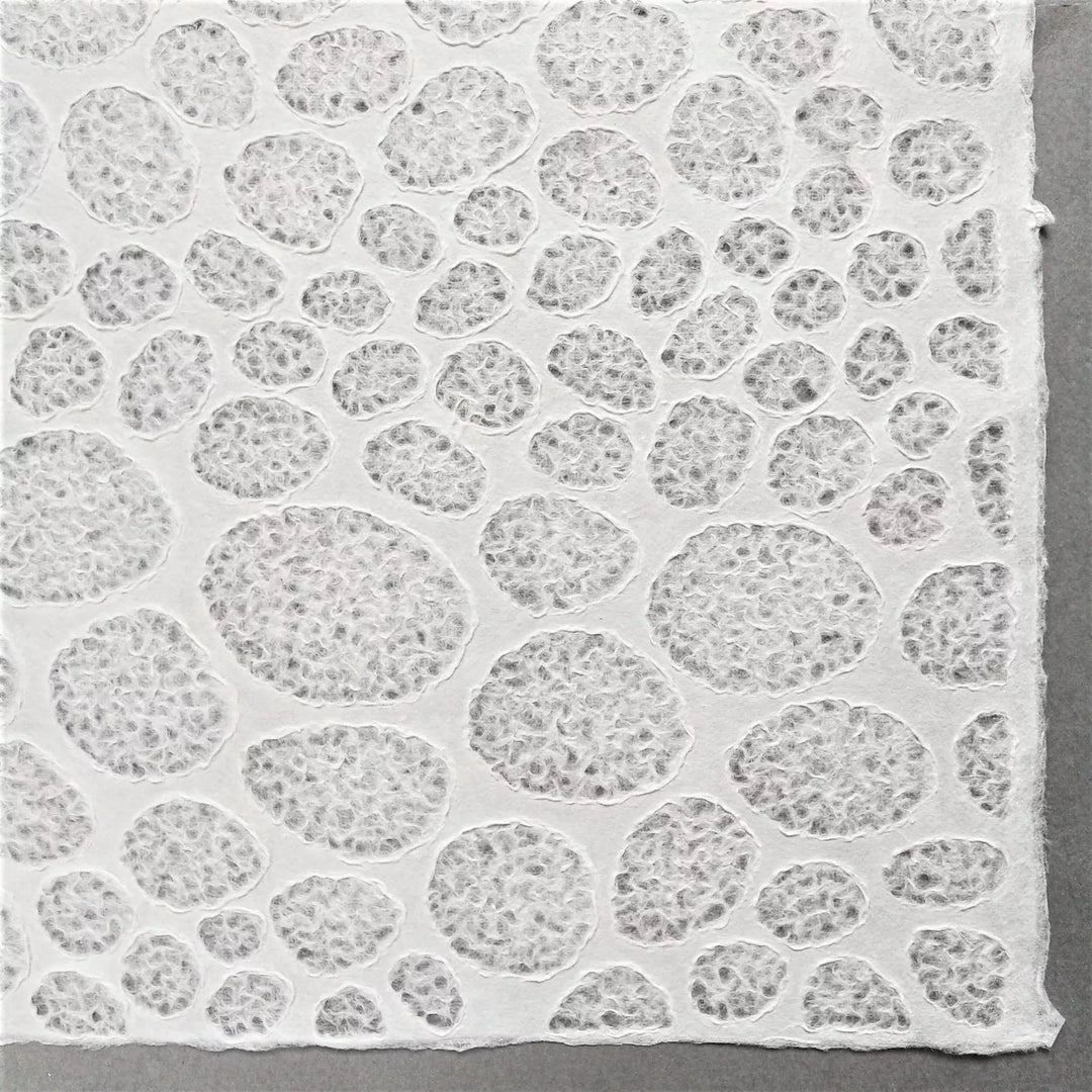 Translucent mulberry paper with a lace stone motif made by Kozo Studio using traditional Rakusui method, suited for both interior and artistic uses.