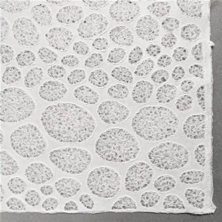 Translucent mulberry paper with a lace stone motif made by Kozo Studio using traditional Rakusui method, suited for both interior and artistic uses.