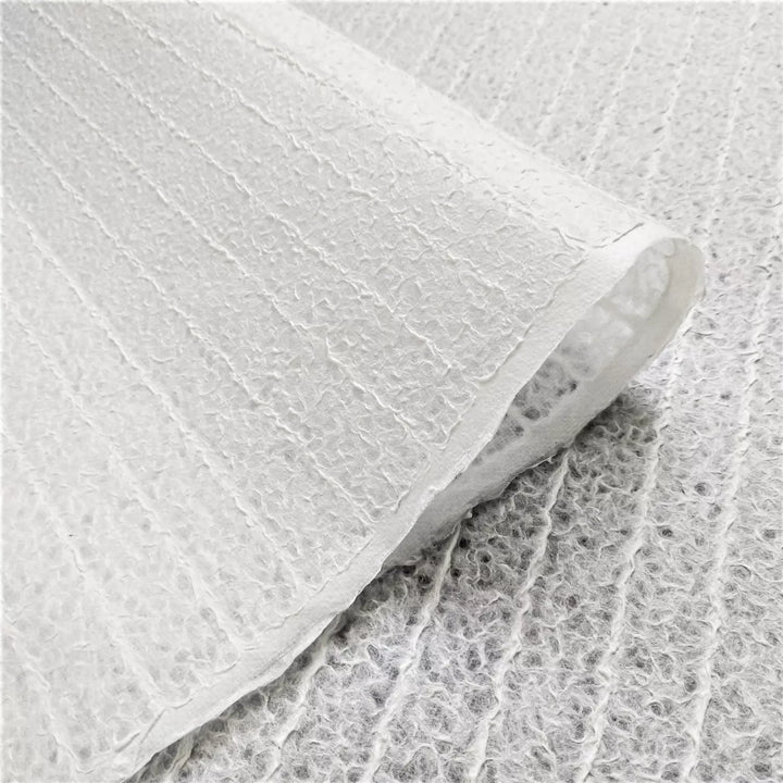 Fine detail of white handmade lace Kozo paper from Kozo Studio, highlighting the Rakusui-crafted design with its soft texture and light-filtering properties typical of high-quality mulberry paper.