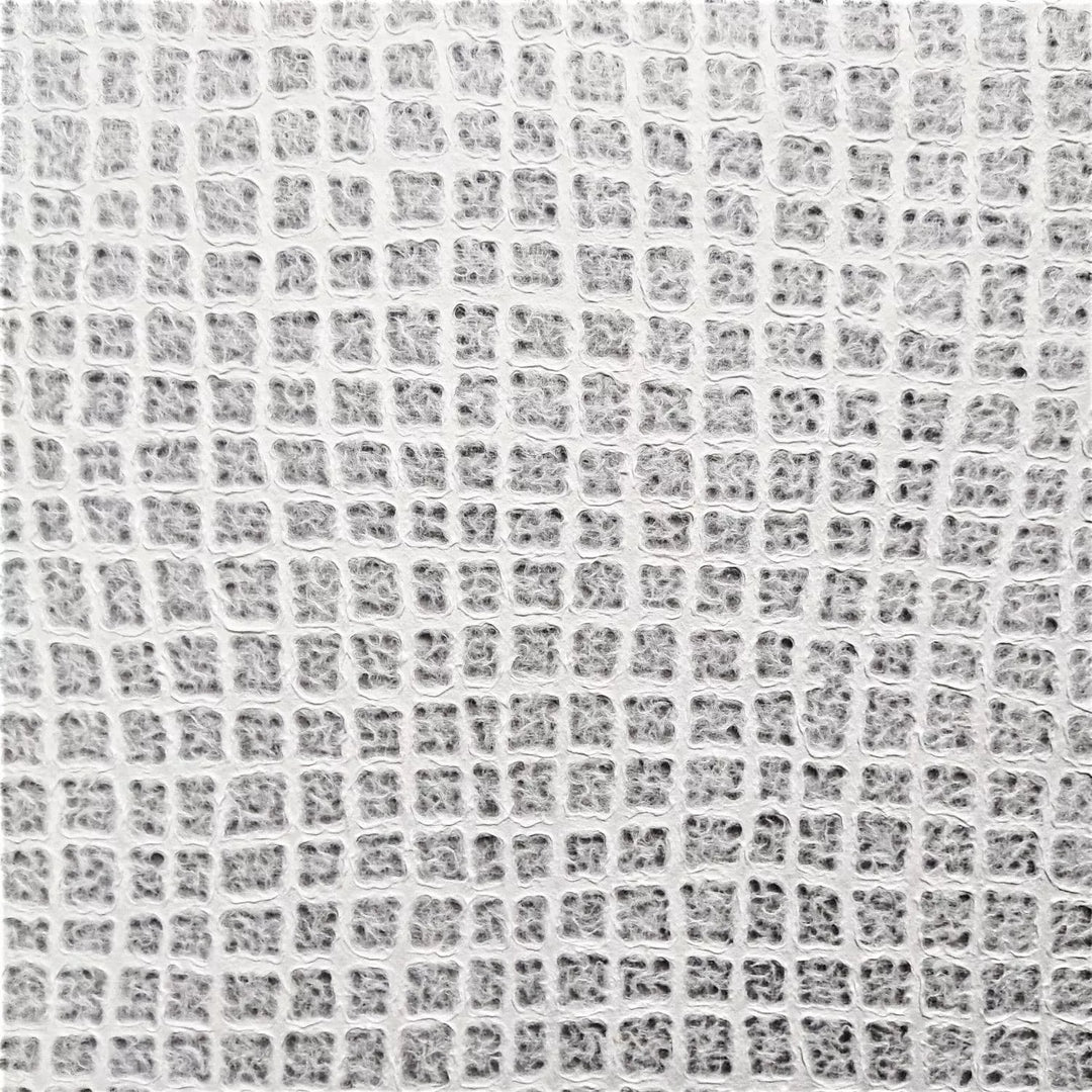 Detailed view of Kozo Studio's handmade paper, highlighting its wafer-like texture and light-filtering properties, made from premium mulberry paper.