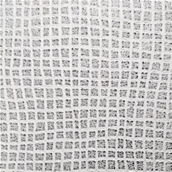 Detailed view of Kozo Studio's handmade paper, highlighting its wafer-like texture and light-filtering properties, made from premium mulberry paper.