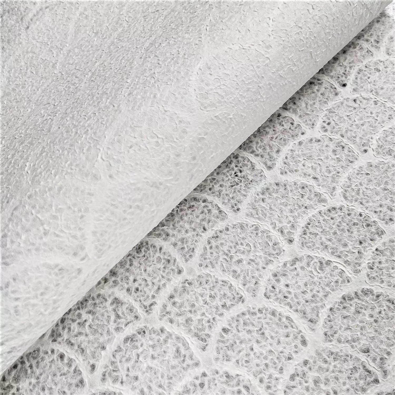 Kozo Studio lace paper in wave pattern, a refined piece of handmade mulberry paper used in decorative and functional design applications.
