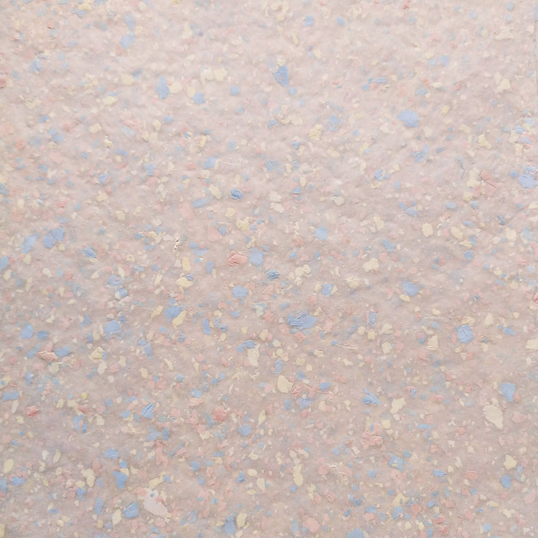 Kozo Studio’s unique handmade mulberry paper with pastel bond inclusions, showcasing a soft texture and versatile artistic potential.