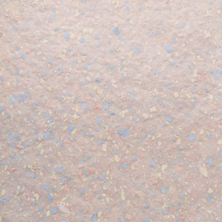 Kozo Studio’s unique handmade mulberry paper with pastel bond inclusions, showcasing a soft texture and versatile artistic potential.