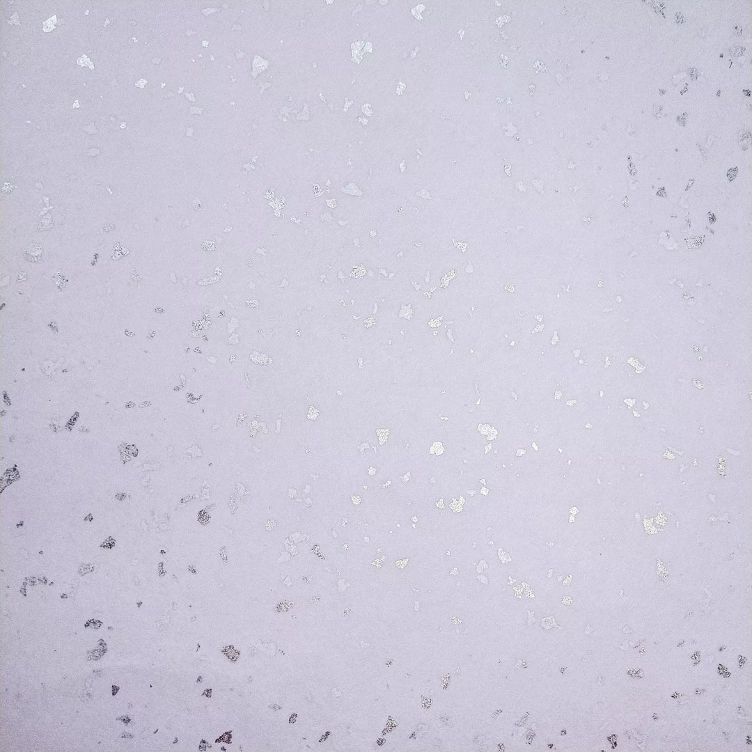 Glittery silver accents scattered across fine kozo paper, a premium handmade paper from Kozo Studio ideal for elegant DIY crafts.