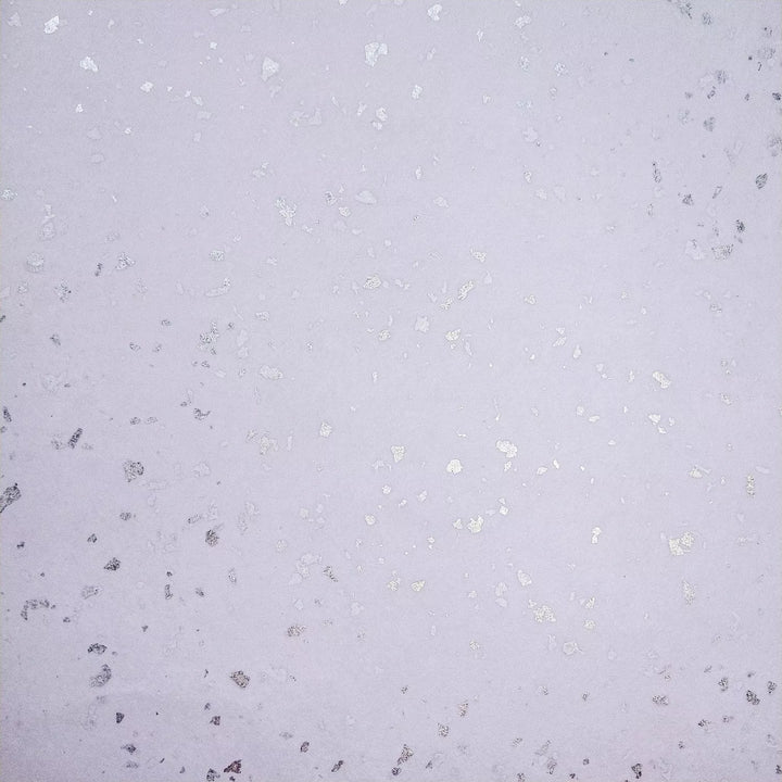 Glittery silver accents scattered across fine kozo paper, a premium handmade paper from Kozo Studio ideal for elegant DIY crafts.
