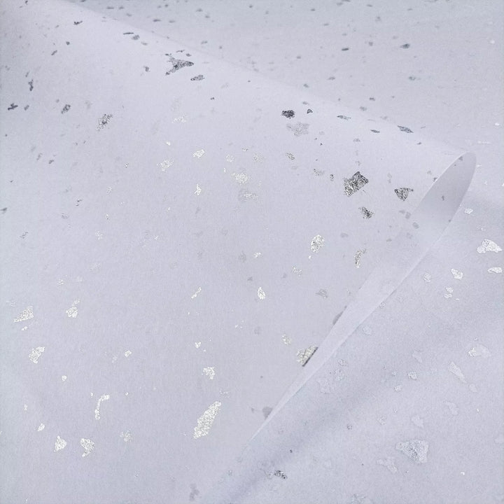 Minimalist mulberry paper with shimmering silver details captured in a Kozo Studio design, showcasing the beauty of high-quality handmade paper.
