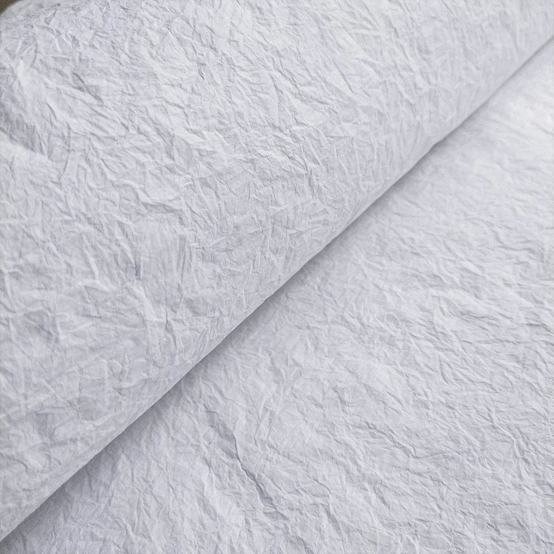Kozo Studio's white Momigami handmade paper made from mulberry, featuring a soft, wrinkled texture for flexible craft applications.