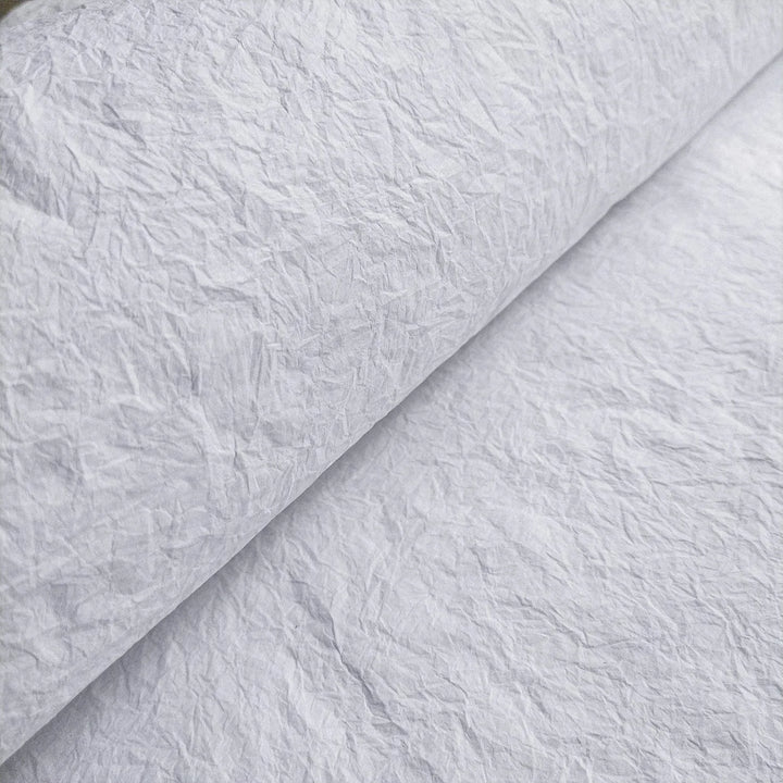 Kozo Studio's white Momigami handmade paper made from mulberry, featuring a soft, wrinkled texture for flexible craft applications.