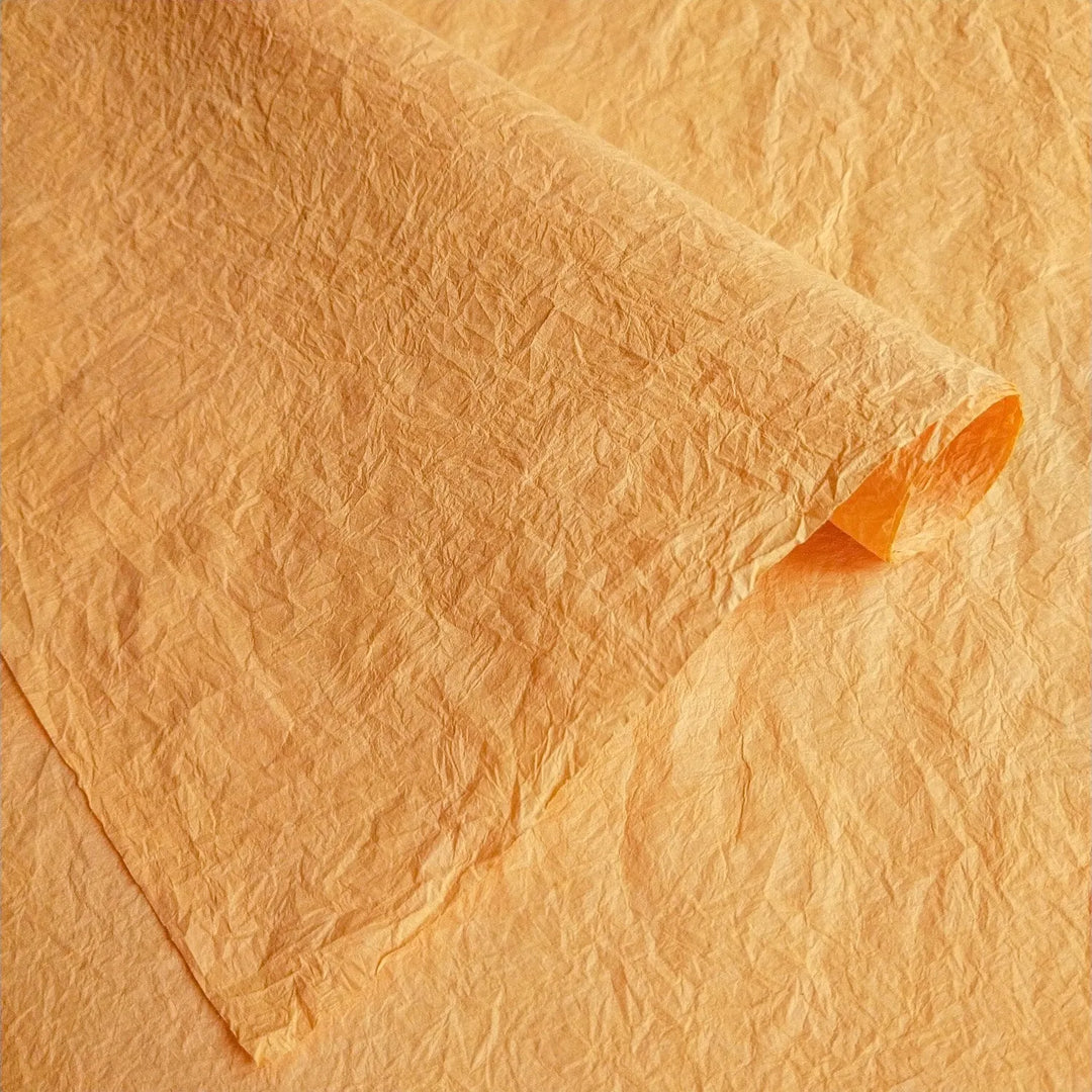 Close-up of flexible Momigami handmade paper from Kozo Studio, highlighting its crumpled texture perfect for gift wrapping, art projects, and decorative paper bags.