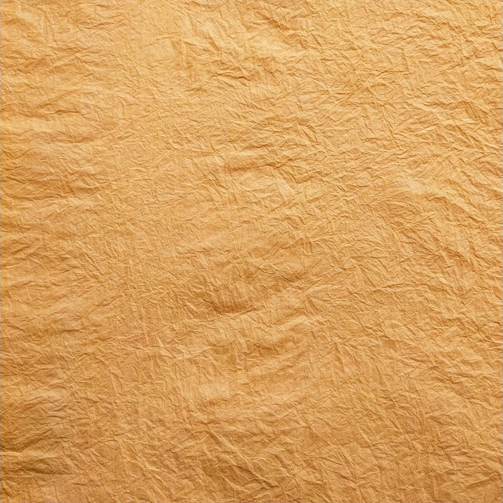 Hand-crumpled Momigami mulberry paper by Kozo Studio showcasing its unique rice paper texture and ideal use in handmade paper crafts like bookbinding and lampshades.